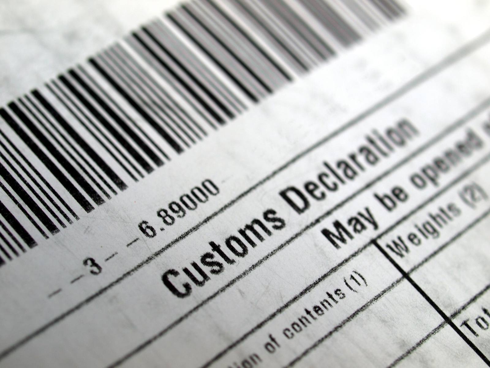 Close-up of a customs declaration label with a barcode